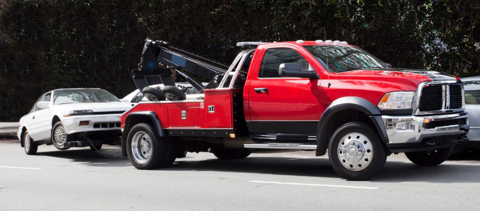 Surprise! Your Car Is G O N E! Red Tow Truck Hauling Away White